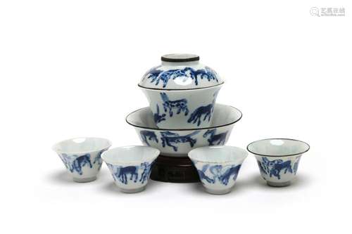 A blue and white porcelain tea set comprising of four teacup...