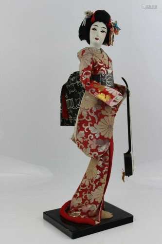 Japanese Doll Geisha Playing With Silk Kimono Dress on Stand...