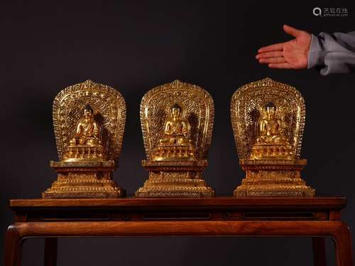 Three holy Buddha statues, goldSize: 20 high 30.5 cm wide by...