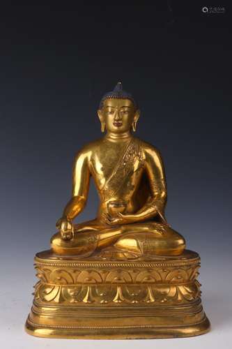 : copper and gold Buddha statue20 cm long 14 cm high 28 cm w...