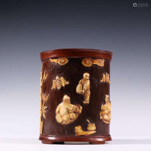 "Four pen container, rosewood teeth glinting in the nar...