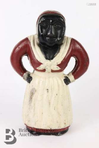 Cast iron money, in the form of a peasant woman, wearing a w