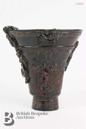 Chinese libation cup, carved in relief with buddhist symboli