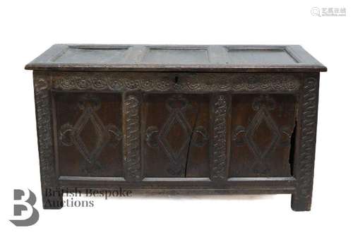 17th century oak coffer, with decorative carving to the fron