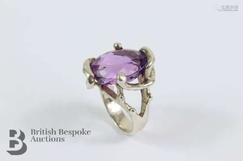 Silver and amethyst ring size S+. The ring set with an oval