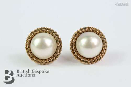 Pair of 9ct yellow gold rope and mabe pearl earrings. The pe