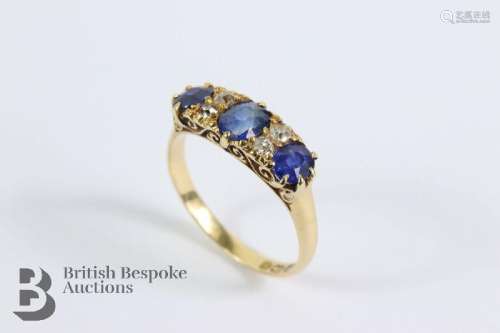 An 18ct yellow gold sapphire and diamond ring. The ring set