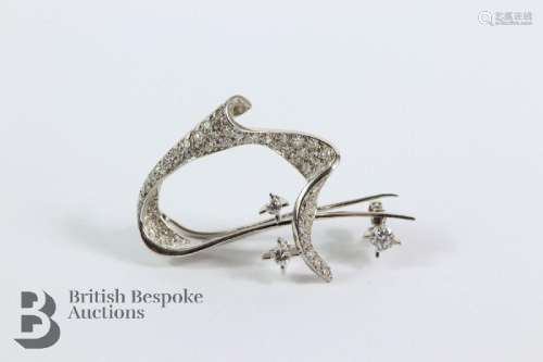 18ct white gold and diamond wave-form brooch. The brooch set