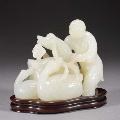 A CHINESE CARVED JADE BOY AND GOOSE