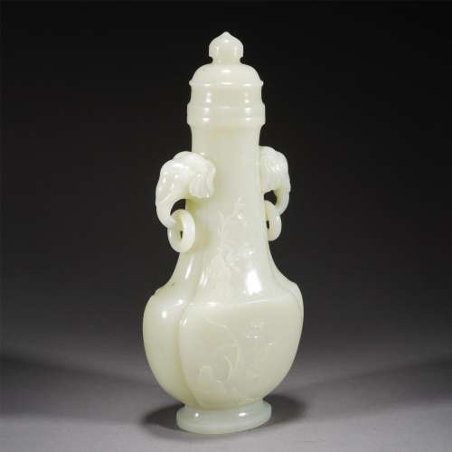 A CHINESE CARVED JADE VASE