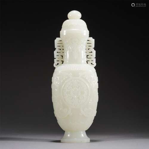 A CHINESE CARVED JADE VASE