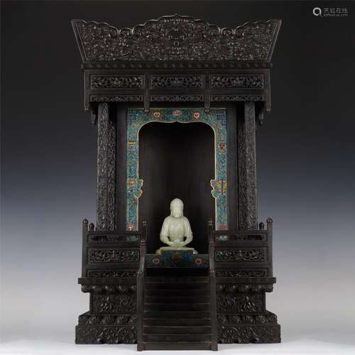 A CARVED JADE SHAKYAMUNI WITH NICHE