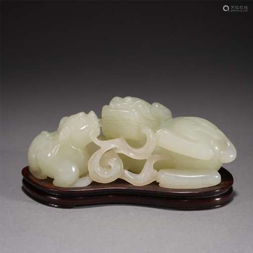 A CHINESE CARVED JADE LIONS GROUP