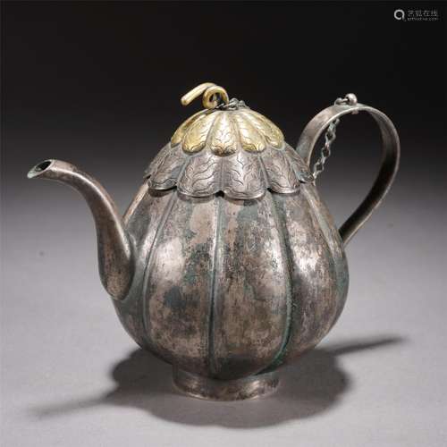 A GILT SILVER MELON SHAPED TEAPOT