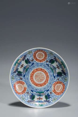 A BLUE AND WHITE AND COLORE DISH