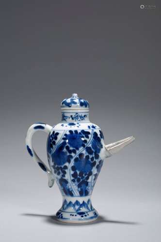 A BLUE AND WHITE FLOWER HANDLE EWER