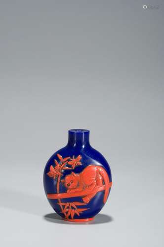 A RED-OVERLAY BLUE GLASS SNUFF BOTTLE WITH CAT AND BUTTERFLY...