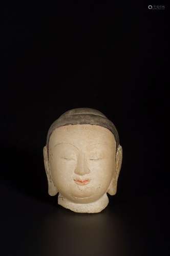 A WHITE MARBLE HEAD OF BUDDHA