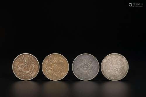 A SET OF 4 CHINESE SILVER COINS