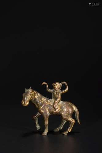 A GILT-COPPER MONKEY AND HORSE