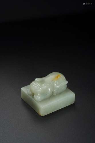 A GREENISH-WHITE JADE TIGER SEAL