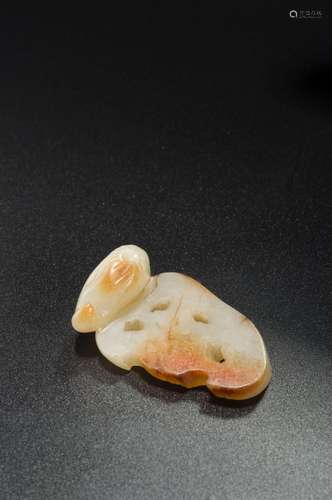 A WHITE JADE LOTUS ROOT PENDANT