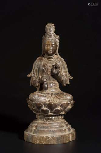 A SOAPSTONE AVALOKITESHVARA STATUE