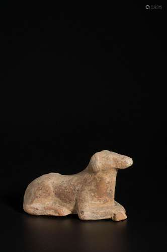 AN ARCHAIC POTTERY DOG