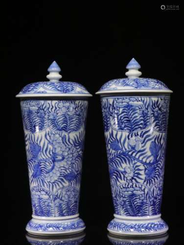 The hand-painted flowers lines cover a pair of blue and whit...
