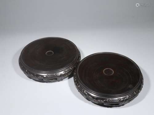 A pair of, lobular rosewood baseSize: 6 cm high, 22.3 cm in ...