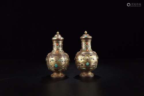 : a pair of silver treasure his presence to admire the bottl...