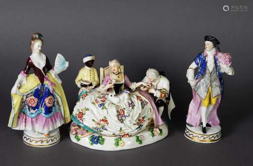 THREE 19TH CENTURY PORCELAIN FIGURE GROUPS, one as a woman w...