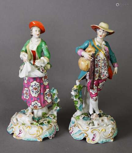 A PAIR OF CHELSEA STYLE FIGURE GROUPS, one as a lady gatheri...