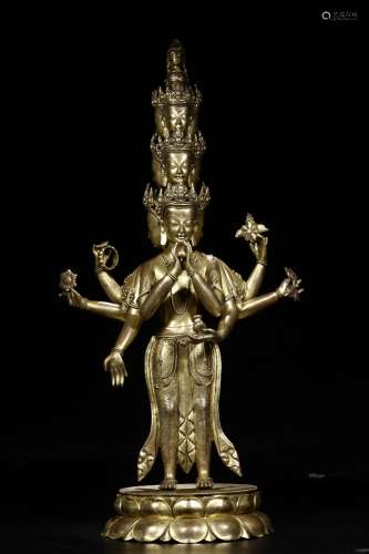 : copper and gold Buddha stands resemble ten side six arm61....