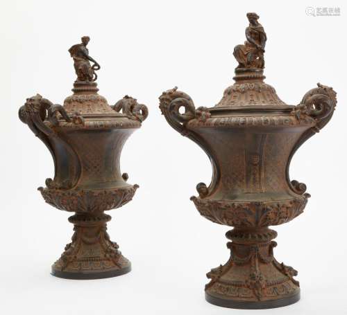 A pair of Louis XIV style bronze patinated resin covered urn...