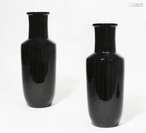 A pair of Chinese black glazed porcelain rouleau vases