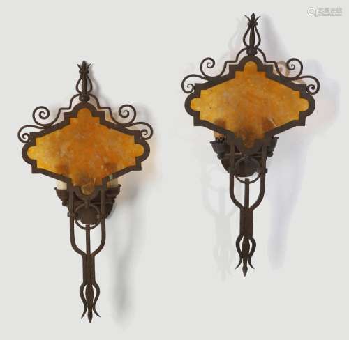 A pair of Renaissance style wrought iron and mica wall light...