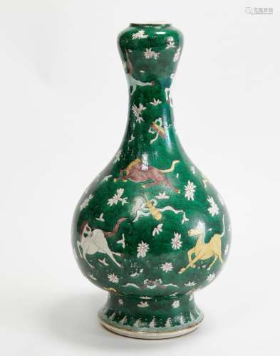 An Asian green and polychrome decorated porcelain garlic mou...