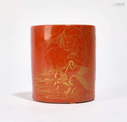 A Chinese porcelain gilt orange glazed brush pot