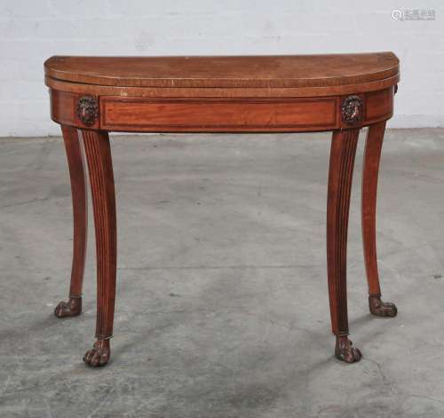 A Regency banded satinwood and mahogany games table, early 1...
