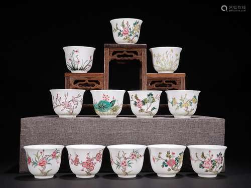 TWELVE CHINESE FAMILLE-ROSE CUPS DEPICTING 'FLORAL',...