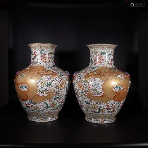 TWO CHINESE GILDED ON WHITE-GROUND FAMILLE-ROSE HANDLED VASE...