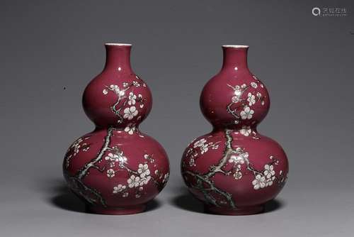 TWO CHINESE PUCE-GROUND FAMILLE-ROSE DOUBLE-GOURD VASES DEPI...