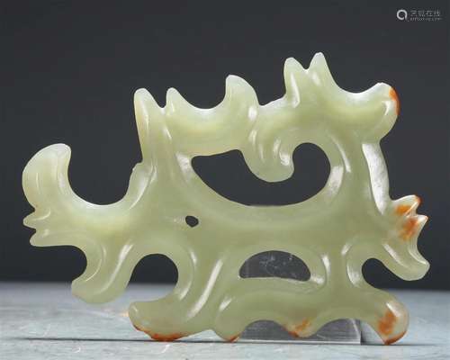 An Archaic Celadon-White Jade 'Curled Cloud' Pendant...