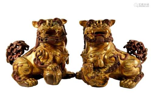 A Pair of Gilt Bronze Lion Statuettes