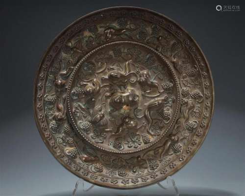 An Archaic Circular Bronze 'Squirrel& Grape' Mir...