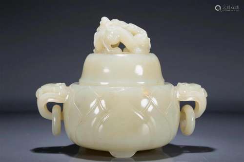 A Magnificent White Jade 'Dragon' Ruyi-Handled Tripo...