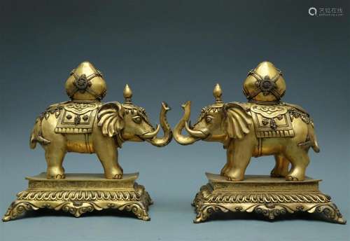 A Magnificent Pair Of Gilt-Bronze Elephants