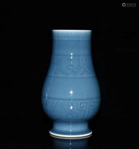 Sky blue glaze carved statue of 15 by 8. 5 cm. 1000