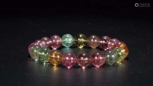 tourmaline d string aSize: diameter of 1 cm weighs 36.9 g.